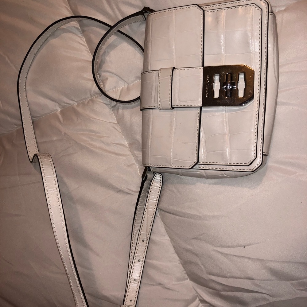 A cute white MK purse! Brand new and never used!
